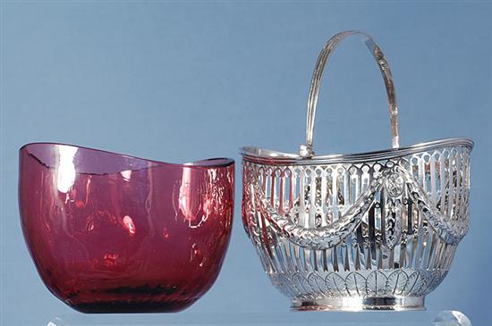 A Victorian silver swing handled sugar basket with cranberry glass liner, length 128mm, weight silver only 5.3oz/151grms